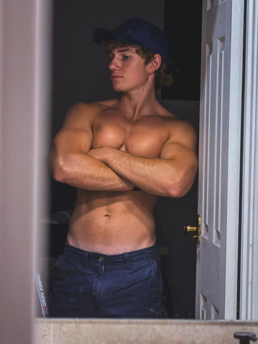 Gabriel standing in a doorway with arms crossed